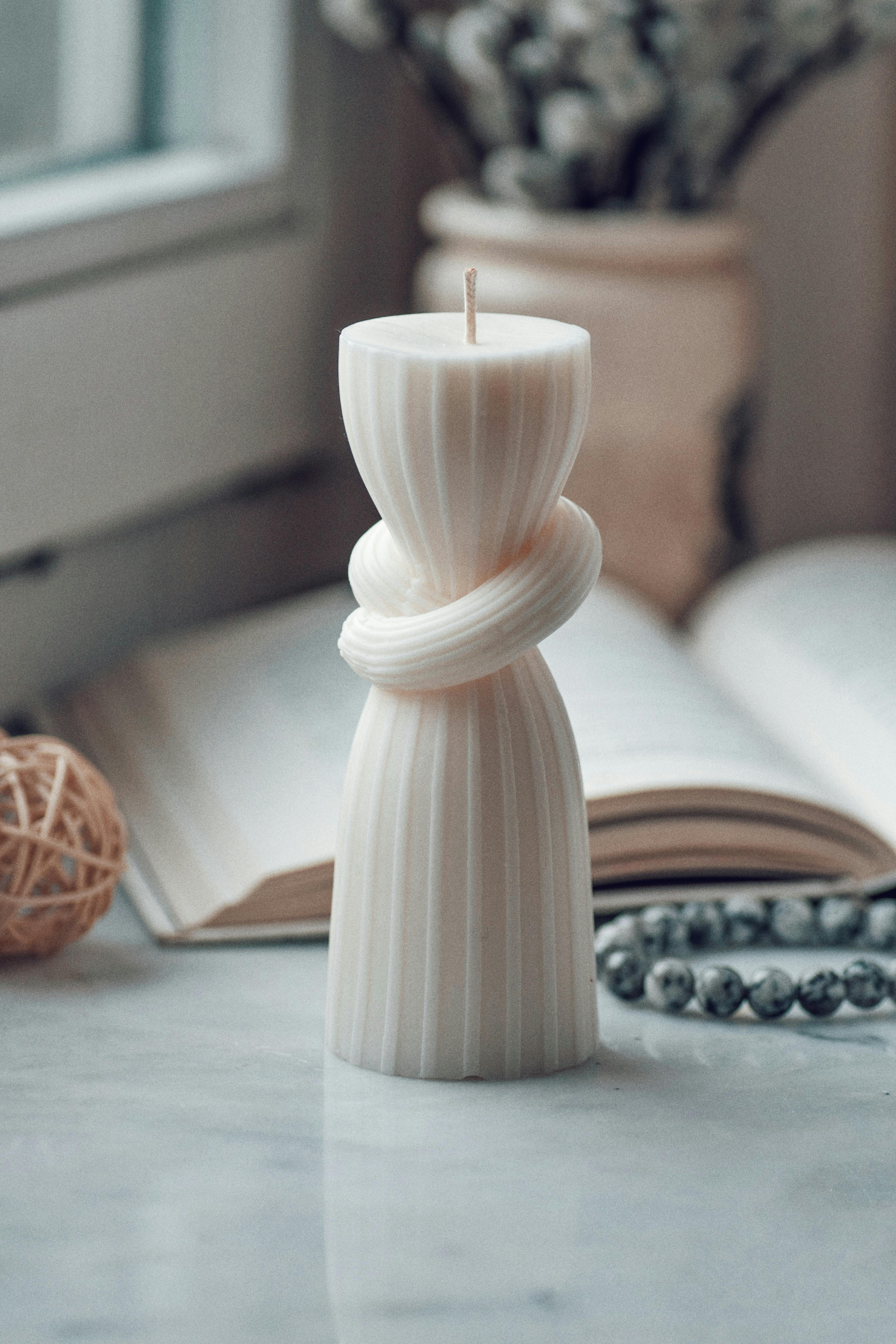Decorative candles placed on wooden table