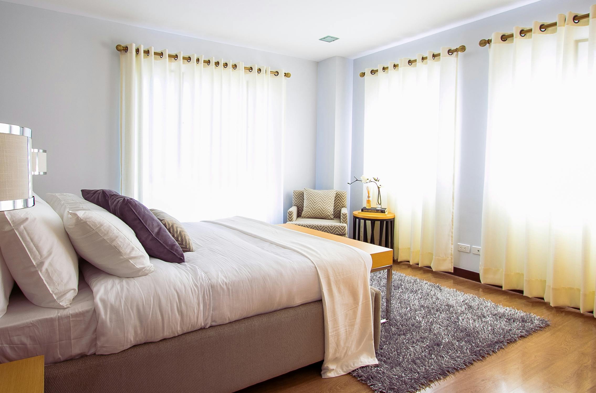 Stylish curtains hanging in bright room